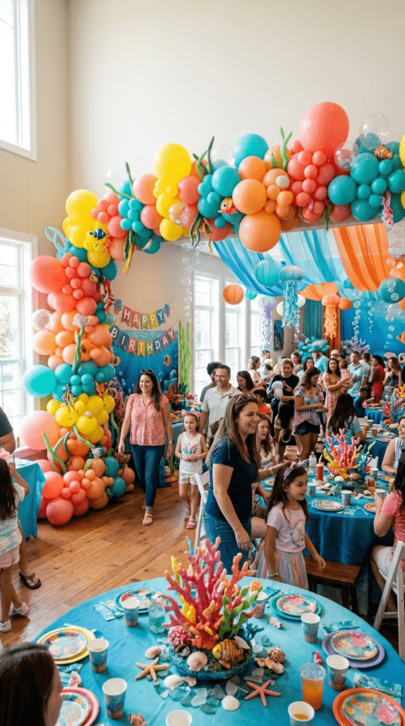 Coral reef themed balloon arch in coral and turquoise colors